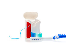dental floss and toothbrush